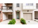 Inviting townhome front entrance includes private garage and coded entry at 423 Burton Dr, Alpharetta, GA 30009