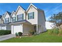Inviting two-story townhome with a one-car garage and manicured landscaping at 6918 Gallant Se Cir # 22, Mableton, GA 30126