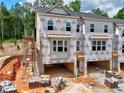 New townhomes under construction with exposed brick and Kingspan GreenGuard weather resistant barrier at 2 Rock Park Way # 13, Tucker, GA 30084