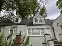 Two-story brick home with dormer windows and inviting front entrance at 55 Beverly Ne Rd, Atlanta, GA 30309