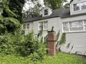 Two-story white brick home with dormer windows and brick chimney at 55 Beverly Ne Rd, Atlanta, GA 30309