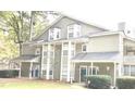 Multi-Gathering exterior view showcases architectural detail, siding, and well-maintained landscaping at 6449 Pinebark Way, Morrow, GA 30260