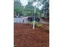 A community street sign shows the way to homes seven and eight at 6449 Pinebark Way, Morrow, GA 30260