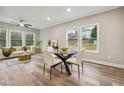 Bright living area with a round glass table, contemporary decor, and warm, natural lighting at 1330 Adams Sw Dr, Atlanta, GA 30311