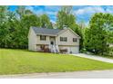 Charming split-level home with a two-car garage and a well-maintained lawn at 236 Fairview Dr, Dallas, GA 30157