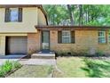This is a close up view of a home's brick exterior and front door at 6419 Danbury Ln, Norcross, GA 30093
