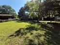 Spacious backyard surrounded by mature trees, providing a private and peaceful retreat at 1215 Sheppard Pl, Stone Mountain, GA 30083