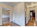 Spacious hallway with hardwood floors and neutral walls creates a seamless flow between rooms at 478 Guilford Cir, Marietta, GA 30068