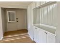 A bright entryway featuring built-in shelving and cabinet storage at 3575 Oakvale Rd # 1103, Decatur, GA 30034
