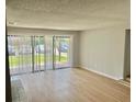 A well-lit living room with large windows and sliding glass doors at 3575 Oakvale Rd # 1103, Decatur, GA 30034