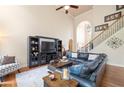 Spacious living room with vaulted ceilings, hardwood floors, and a comfortable seating area at 417 Rhodes House Dr, Suwanee, GA 30024