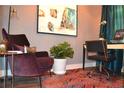 Comfortable office space featuring an inviting arm chair, sleek desk, stylish decor, and vibrant artwork at 1350 May Avenue # 14, Atlanta, GA 30316