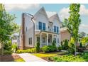 Beautiful two-story home with a brick chimney and well-maintained landscaping at 750 Tannery Cmn, Alpharetta, GA 30009