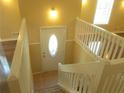 Inviting entryway featuring a staircase with white railings and a decorative front door at 2845 Woodhollow Ln, Jonesboro, GA 30236