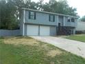 Well-maintained gray home with a two-car garage and a neat front yard at 2845 Woodhollow Ln, Jonesboro, GA 30236