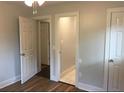Bright bedroom with hardwood floors and white trim at 4324 Rocklane Dr, Conley, GA 30288