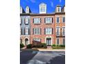 Elegant brick townhome showcasing classic architectural details, black shutters, and professionally landscaped grounds at 4206 Whitby Se Way # 15, Smyrna, GA 30080