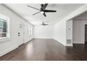 Bright living room with many windows and ceiling fan at 7540 Conyers St, Lithonia, GA 30058