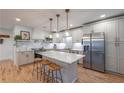 Modern kitchen features white cabinets, marble backsplash, and stainless steel appliances at 82 Dearborn Se St, Atlanta, GA 30317