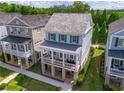 Beautiful two-story home with a welcoming front porch and manicured landscaping in a serene neighborhood at 7455 Cordery Rd, Cumming, GA 30040