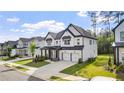 Charming two-story home with a two-car garage, well-maintained lawn, and attractive curb appeal at 298 Tillman Pass, Woodstock, GA 30188