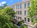 Charming brick building with mature trees and landscaping, showcasing the property's inviting curb appeal at 3408 Landen Pine Ne Ct, Atlanta, GA 30305