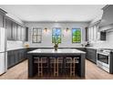 Modern kitchen with grey cabinetry, a large center island, and stainless steel appliances at 3408 Landen Pine Ne Ct, Atlanta, GA 30305