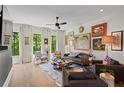 Bright living room with hardwood floors, multiple windows, and stylish decor at 3408 Landen Pine Ne Ct, Atlanta, GA 30305