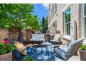 Outdoor patio seating area with a grill and a beautiful garden at 3408 Landen Pine Ne Ct, Atlanta, GA 30305