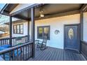 Inviting front porch with rocking chairs and a charming wreath on the front door at 52 Buena Vista Se Cir, Cartersville, GA 30121