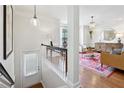 Bright entryway leading to a living room with hardwood floors, stylish furnishings, and elegant decor at 2143 Yancey Ne Ln, Atlanta, GA 30319