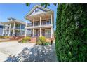Charming two-story home with double balconies, pretty landscaping, and a convenient driveway at 3416 Harrison Rd, Atlanta, GA 30344