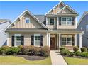 Charming two-story home with manicured landscaping and craftsman-style architecture, showing great curb appeal at 1580 Johnson Nw Rd, Atlanta, GA 30318