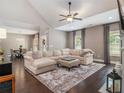 Comfortable living room featuring vaulted ceilings, a ceiling fan, and a cozy seating area at 1580 Johnson Nw Rd, Atlanta, GA 30318