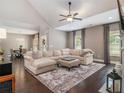 Spacious living room with vaulted ceiling, plush seating, and hardwood floors throughout the open floorplan at 1580 Johnson Nw Rd, Atlanta, GA 30318