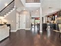 Spacious open floor plan with hardwood floors seamlessly connecting the living area and kitchen at 1580 Johnson Nw Rd, Atlanta, GA 30318