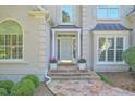 Inviting front entrance with a stone walkway and a charming light blue front door at 2250 Edgemere Lake Cir, Marietta, GA 30062