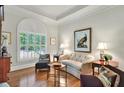 Elegant living room with refined details, tray ceilings, and lots of natural light at 2250 Edgemere Lake Cir, Marietta, GA 30062