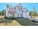 Beautiful two-story home with a two-car garage and a well-maintained front lawn with landscaping at 3440 Carswell Bnd, Cumming, GA 30028