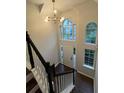 Bright foyer with tall ceilings, large windows, and modern lighting fixture at 1015 Crest Ridge Sw Pl, Marietta, GA 30060