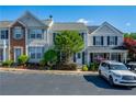 Inviting townhome with well-maintained landscaping, charming shutters, and convenient parking at 1240 Kilmington Ct, Alpharetta, GA 30009