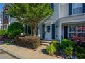 Inviting townhome with fresh landscaping, decorative shutters, and a neatly maintained entryway at 1240 Kilmington Ct, Alpharetta, GA 30009