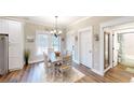 Bright dining area with hardwood floors, a dining table, and natural light at 40 Luther Knight Se Rd, Cartersville, GA 30121