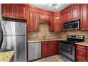 Modern kitchen with stainless steel appliances, granite countertops, and ample cabinet storage at 1421 Peachtree Ne St # 211, Atlanta, GA 30309