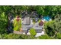 Aerial view of the estate showcasing the sprawling property, lush greenery, and swimming pool at 2890 Howell Mill Rd, Atlanta, GA 30327