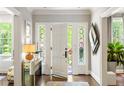 Inviting foyer with hardwood floors, stylish console table, and decorative accents at 2890 Howell Mill Rd, Atlanta, GA 30327