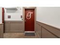 Condo entrance with neutral color and trim and monogrammed red door at 383 Grant Se Cir # 1634, Atlanta, GA 30315
