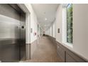 Bright hallway with elevator, neutral colors, large windows and trim at 383 Grant Se Cir # 1634, Atlanta, GA 30315