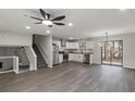 Open concept living space boasts sleek flooring, modern lighting, and stainless steel appliances at 3840 Natalie Way, Ellenwood, GA 30294