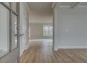 Open foyer with wood-look floors, decorative trim, and a view into the adjacent living spaces at 4032 Andover Cir, Mcdonough, GA 30252